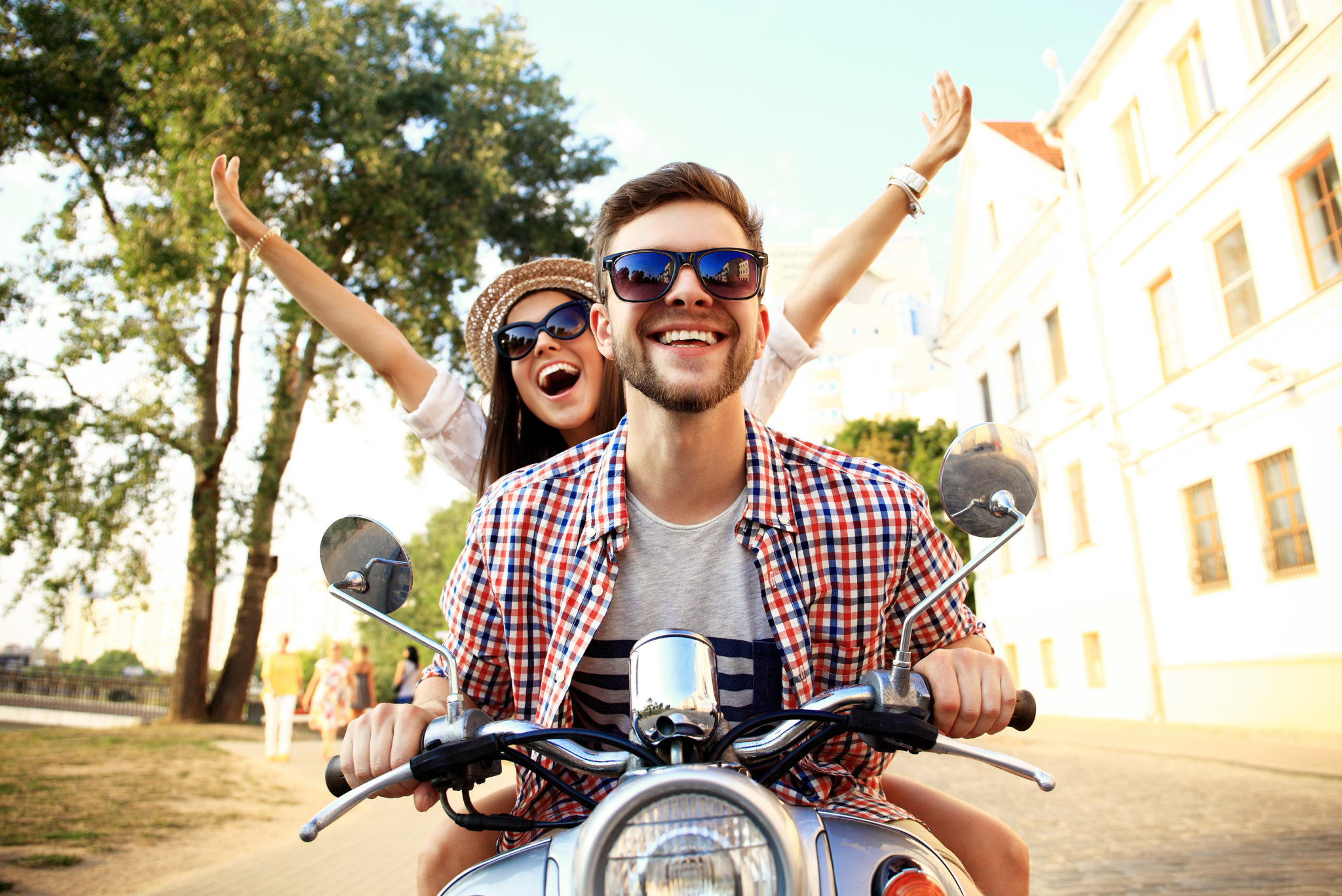 Couple in love riding a motorbike , Handsome guy and young sexy woman travel . Young riders enjoying themselves on trip. Adventure and vacations concept.
